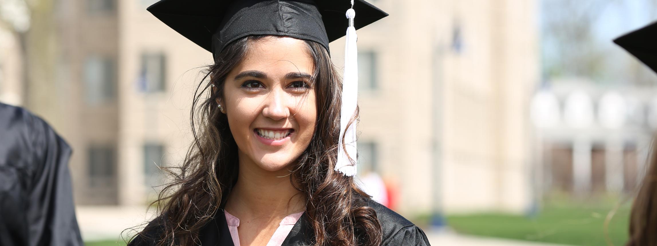 female student in a cap and gown