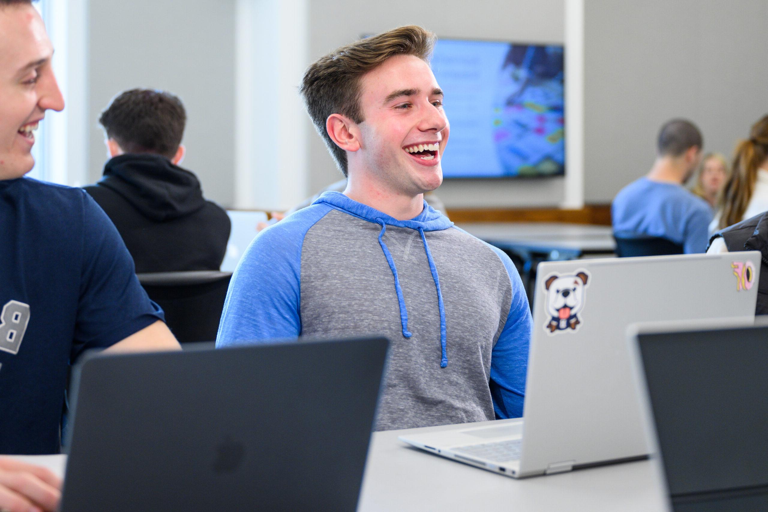 Male 皇冠投注 student smiling during class.